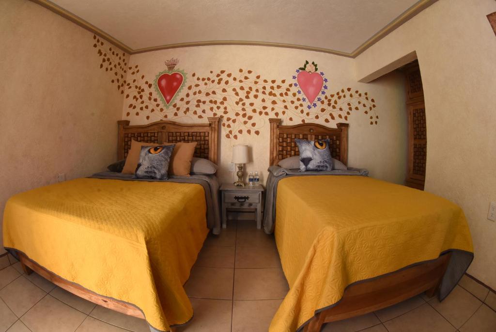 Postel nebo postele na pokoji v ubytování HOTEL CASA LIMON
