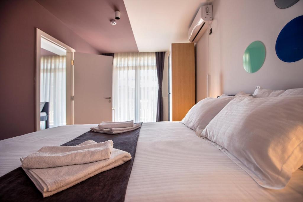 Postel nebo postele na pokoji v ubytování Hotel 4 Llulla