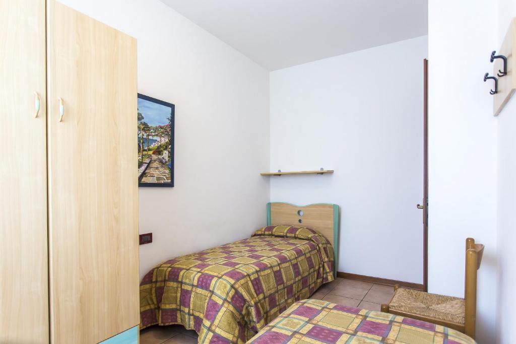 A bed or beds in a room at Villaggio Calycanthus