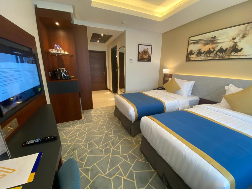 TV a/nebo společenská místnost v ubytování Velar Inn Hotel