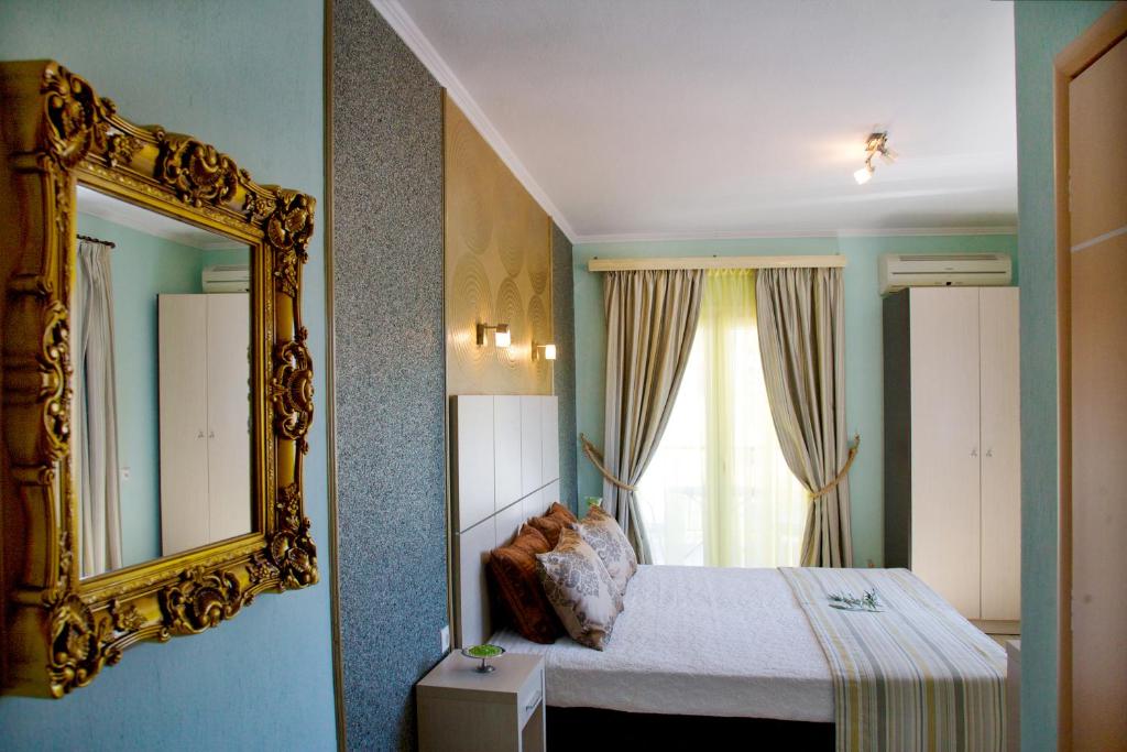 Postel nebo postele na pokoji v ubytování Kaplanis House