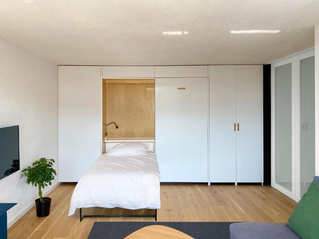 Postel nebo postele na pokoji v ubytování Grüezi Laax Apartments