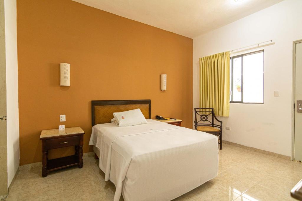 Postel nebo postele na pokoji v ubytování Hotel María Jose