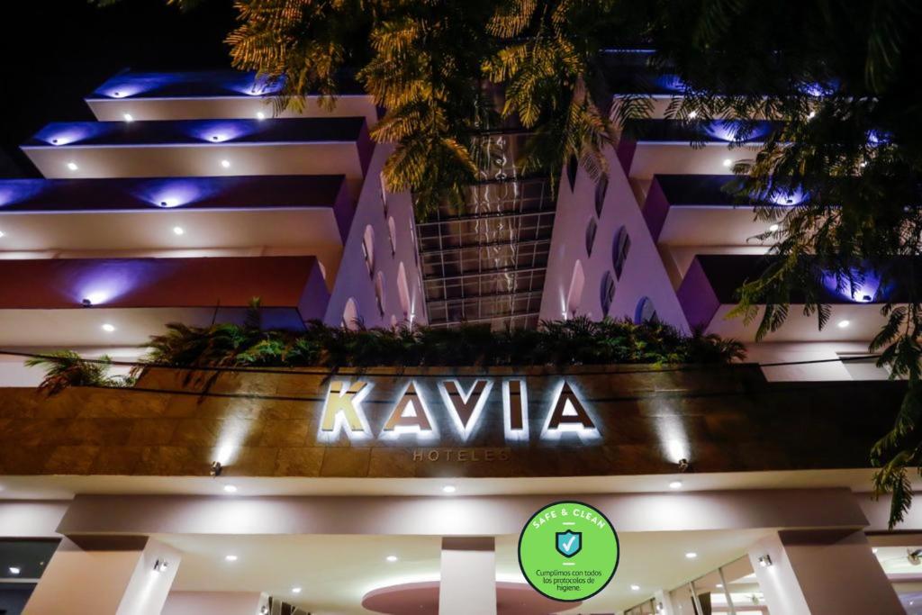 a building with a sign in front of it at Hotel Kavia in Cancún