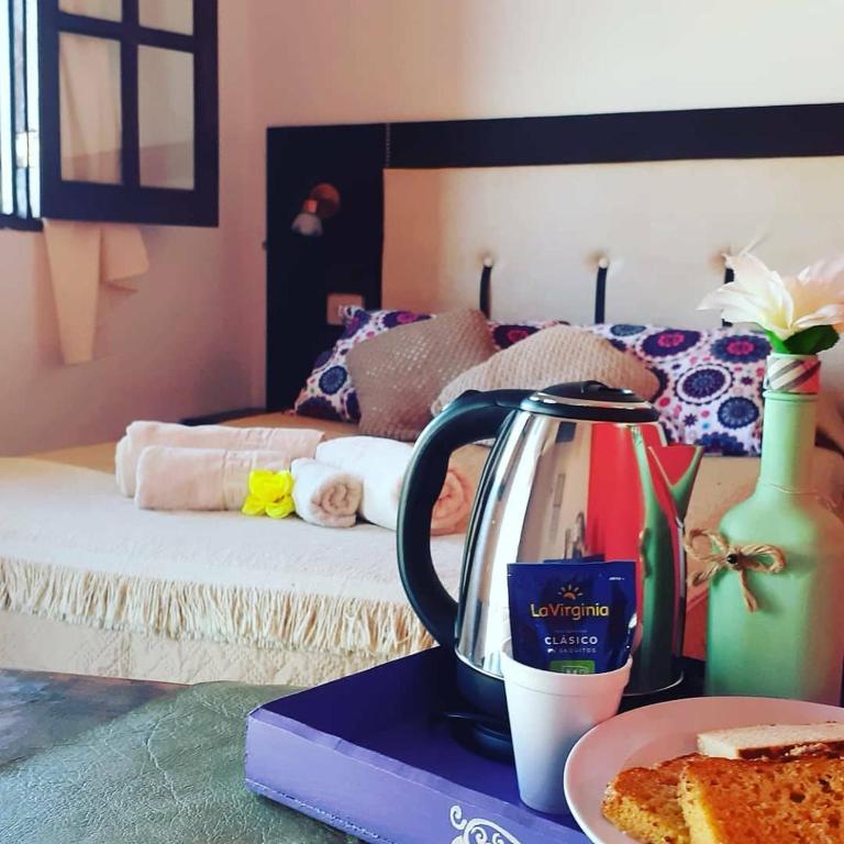 Postel nebo postele na pokoji v ubytování Hostal Sisabel