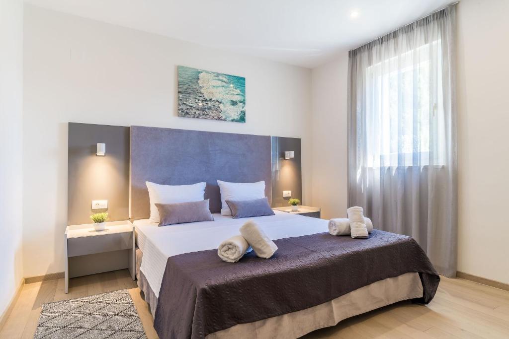 Postel nebo postele na pokoji v ubytování Art Hotel Dubrovnik