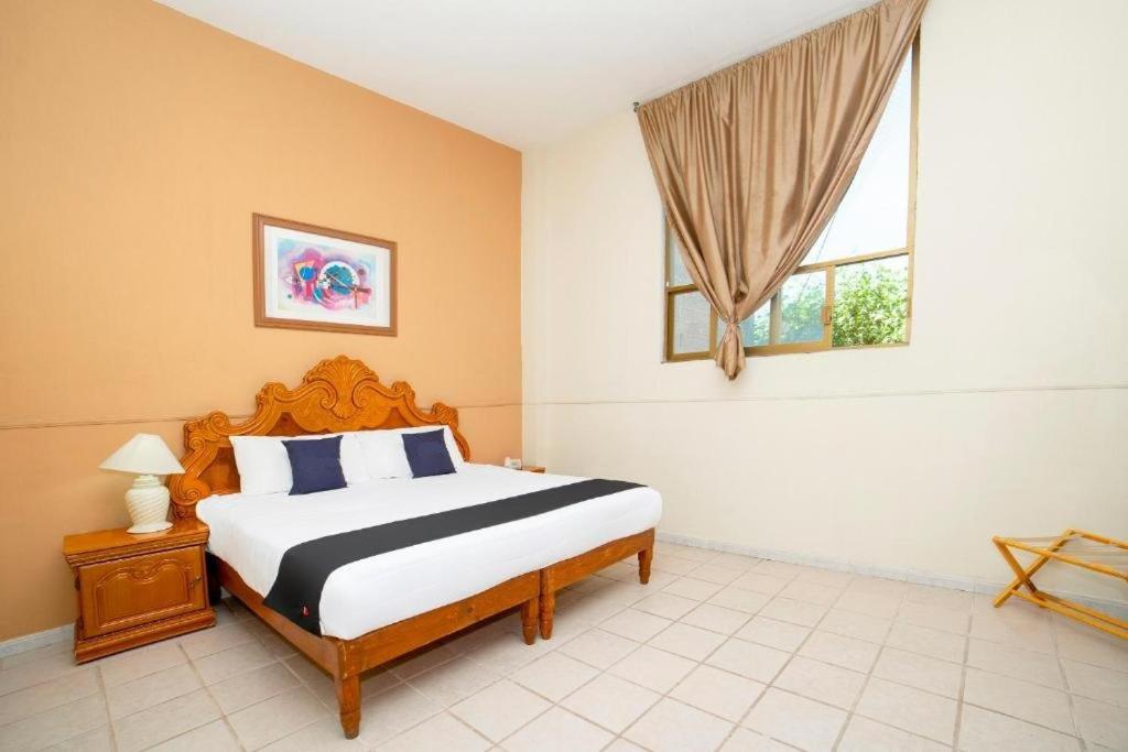 מיטה או מיטות בחדר ב-Capital OC hotel Marney