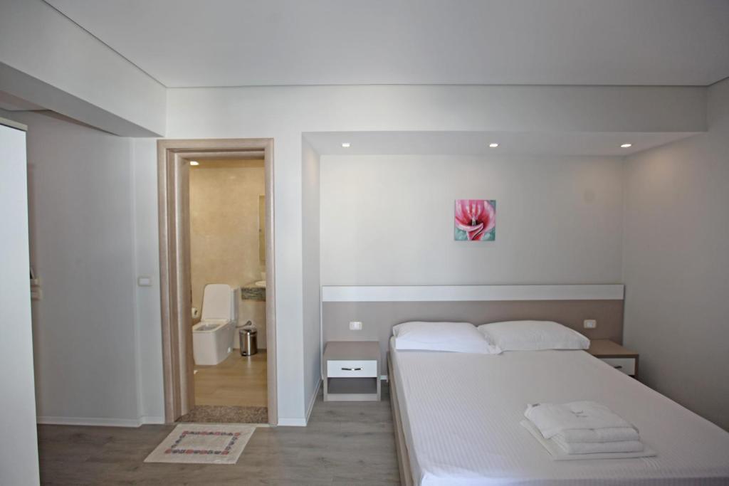 Postel nebo postele na pokoji v ubytování Star Hotel Saranda