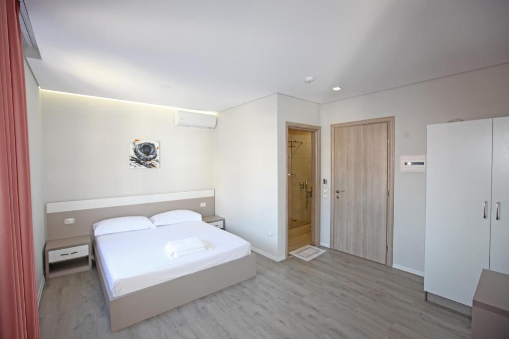 Postel nebo postele na pokoji v ubytování Star Hotel Saranda
