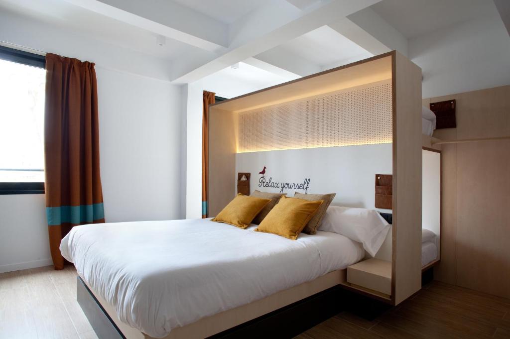 Postel nebo postele na pokoji v ubytování Toc Hostel Sevilla