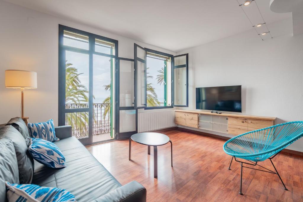 Televízia a/alebo spoločenská miestnosť v ubytovaní InSitges Ribera's Beach