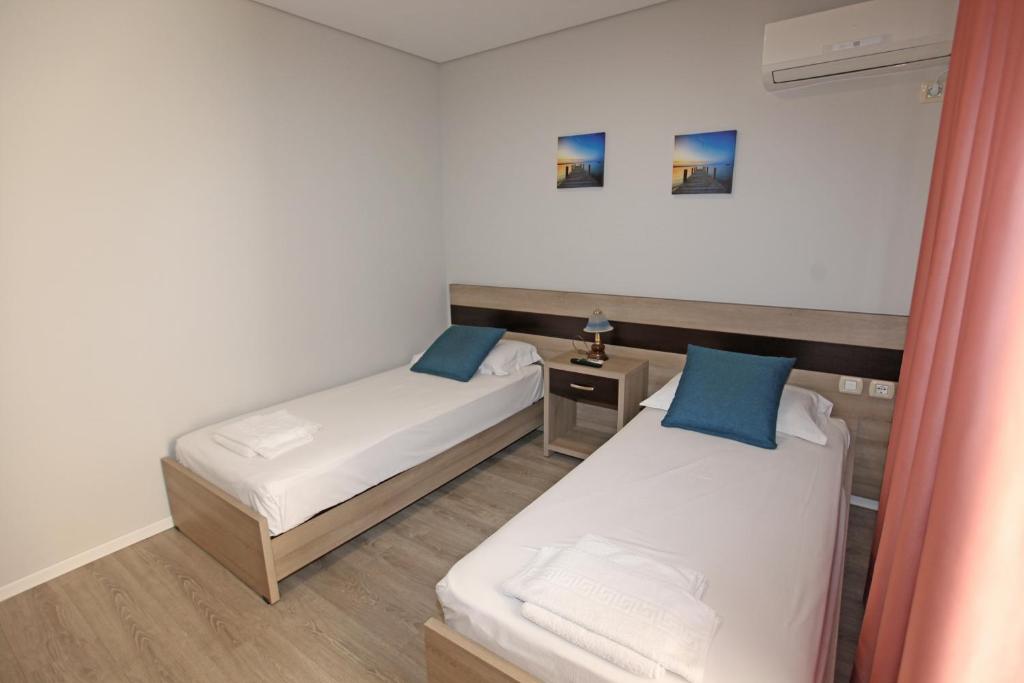 Postel nebo postele na pokoji v ubytování Star Hotel Saranda