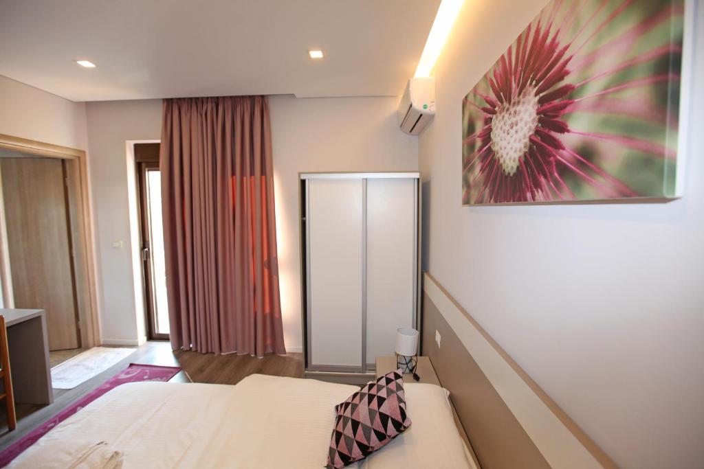 Postel nebo postele na pokoji v ubytování Star Hotel Saranda
