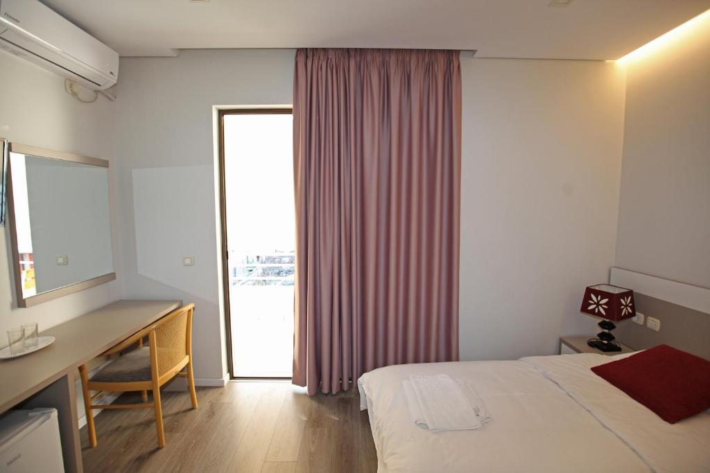 Postel nebo postele na pokoji v ubytování Star Hotel Saranda