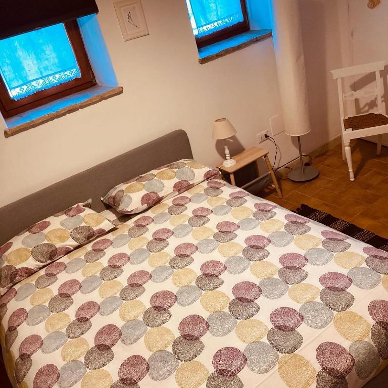 Postel nebo postele na pokoji v ubytování CIRIBACCO ROOMS