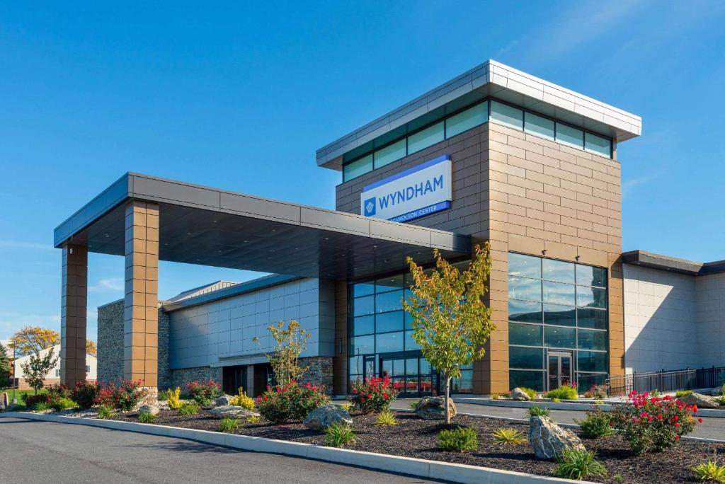 a building with a sign on the front of it at Wyndham Lancaster Resort and Convention Center in Lancaster