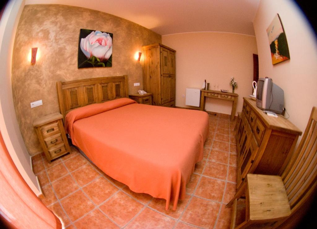 Posteľ alebo postele v izbe v ubytovaní Hotel Rural El Arriero