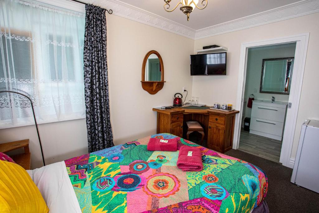 Postel nebo postele na pokoji v ubytování Richmond Guest House