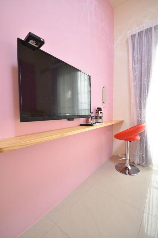 TV a/nebo společenská místnost v ubytování 好時光電梯民宿