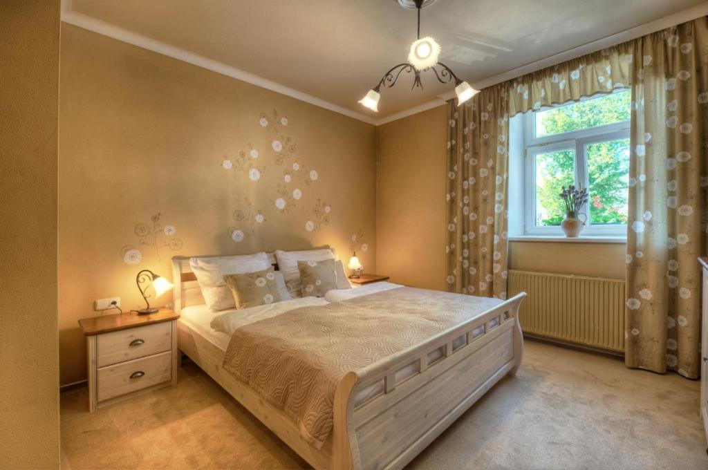 Łóżko lub łóżka w pokoju w obiekcie Hotel Panský dům