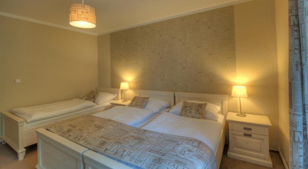 Łóżko lub łóżka w pokoju w obiekcie Hotel Panský dům