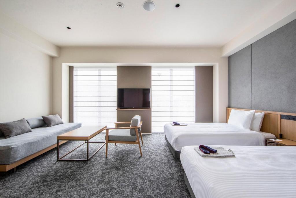 Postel nebo postele na pokoji v ubytování Park Hotel Kyoto