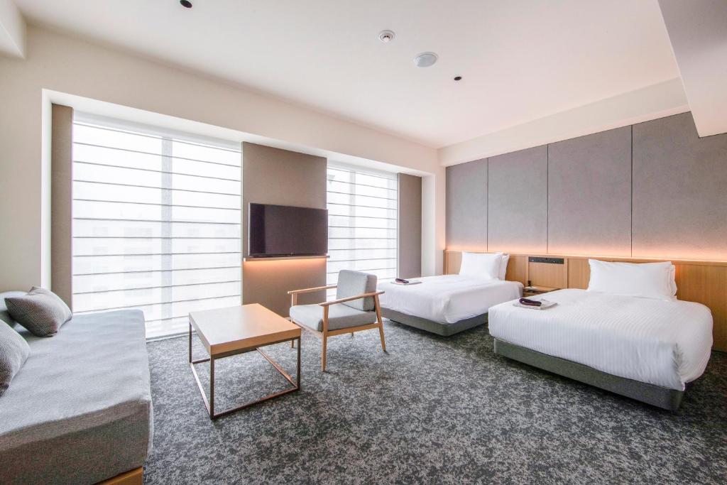 Postel nebo postele na pokoji v ubytování Park Hotel Kyoto