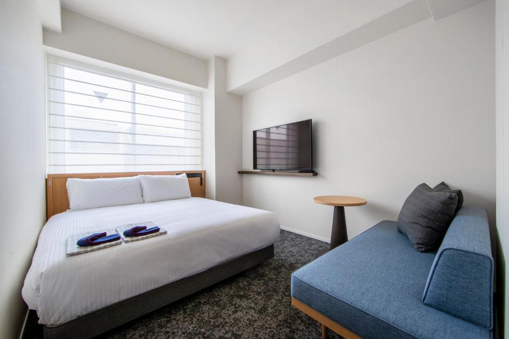 Postel nebo postele na pokoji v ubytování Park Hotel Kyoto