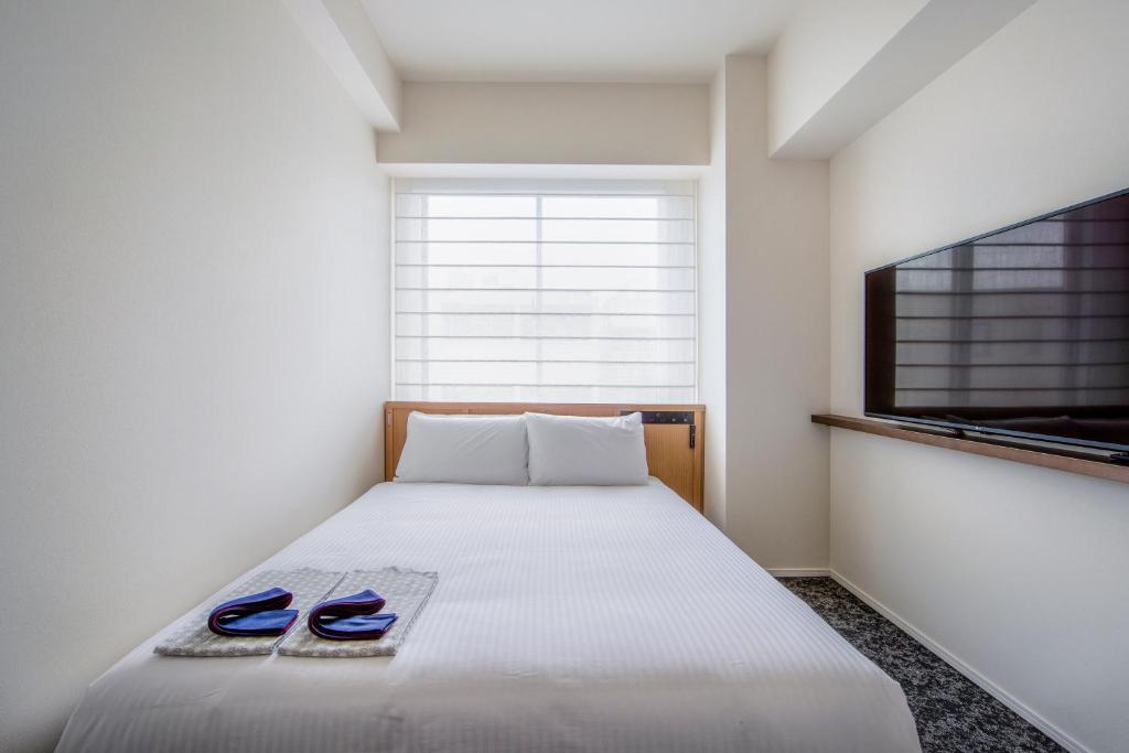Postel nebo postele na pokoji v ubytování Park Hotel Kyoto