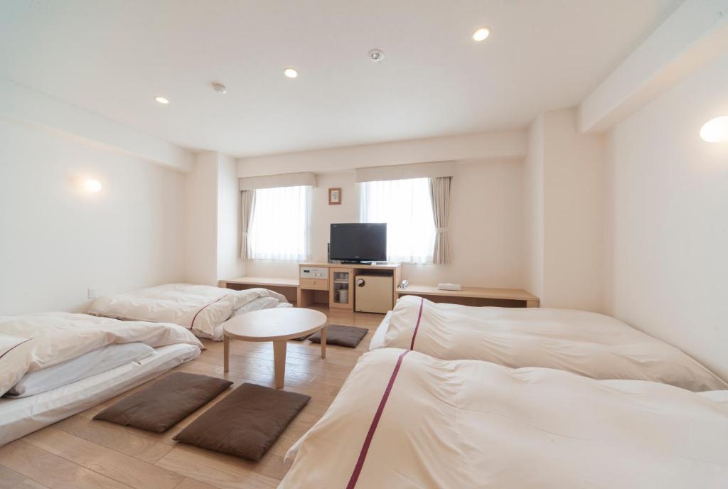 Postel nebo postele na pokoji v ubytování Okayama View Hotel
