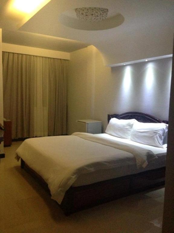 Postel nebo postele na pokoji v ubytování DoDo Guesthouse