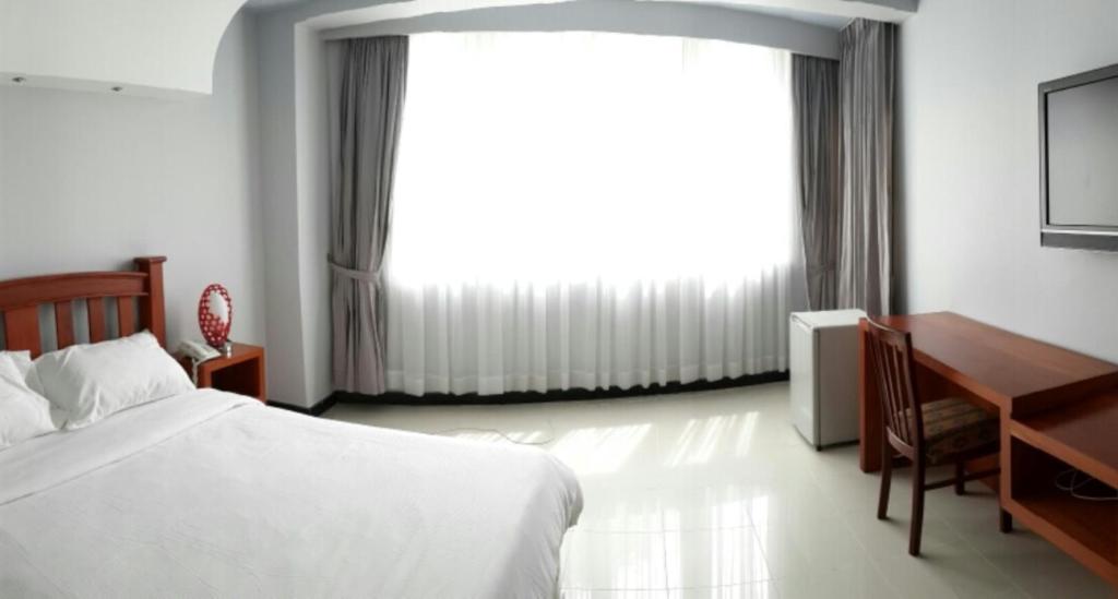 Postel nebo postele na pokoji v ubytování DoDo Guesthouse