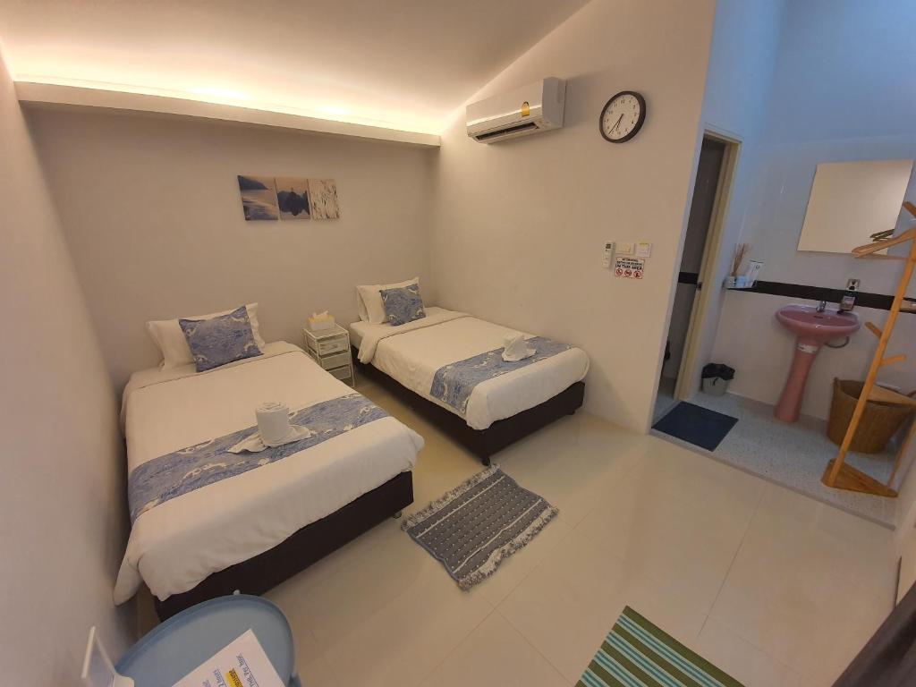 Postel nebo postele na pokoji v ubytování Napa Hostel Samrong Station