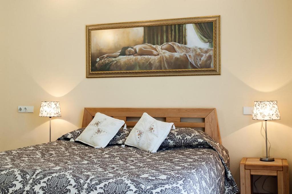 A bed or beds in a room at Saulės Krantas
