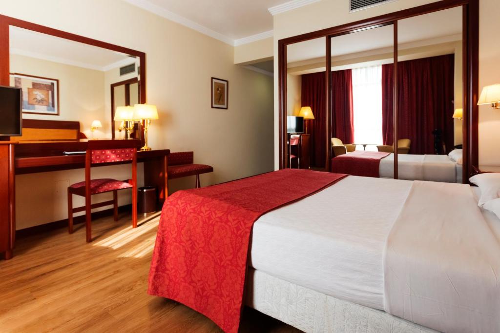 Posteľ alebo postele v izbe v ubytovaní Gran Hotel de Ferrol