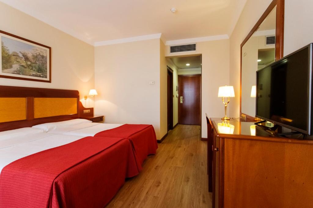 Posteľ alebo postele v izbe v ubytovaní Gran Hotel de Ferrol