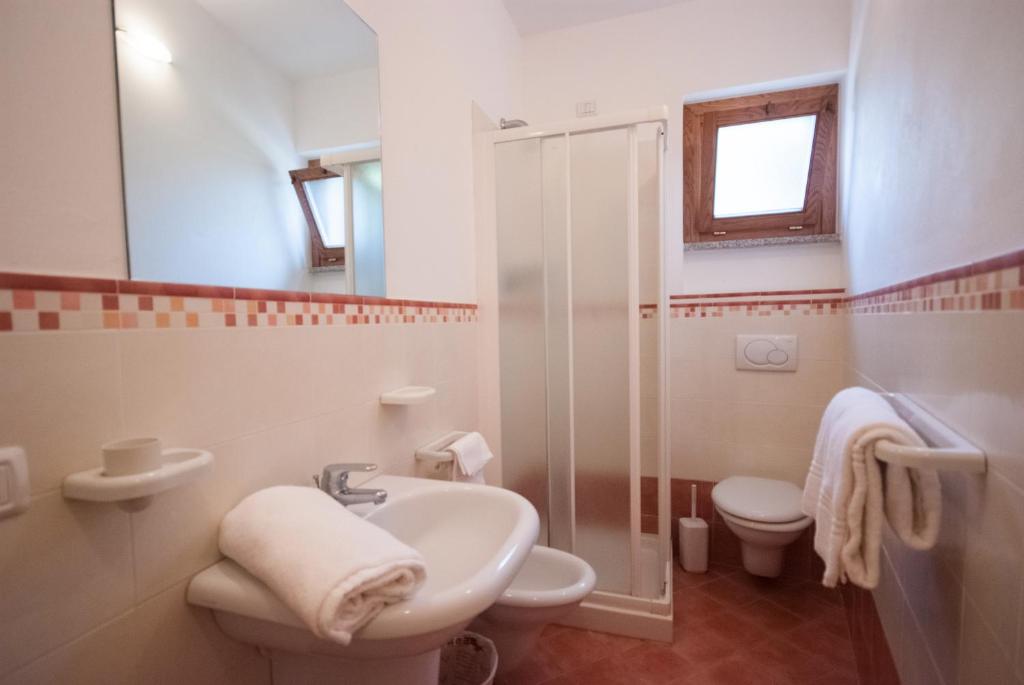 Łazienka w obiekcie Residence Le Grazie Est