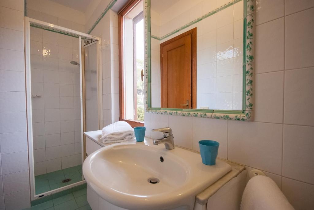 Łazienka w obiekcie Residence Le Grazie Est