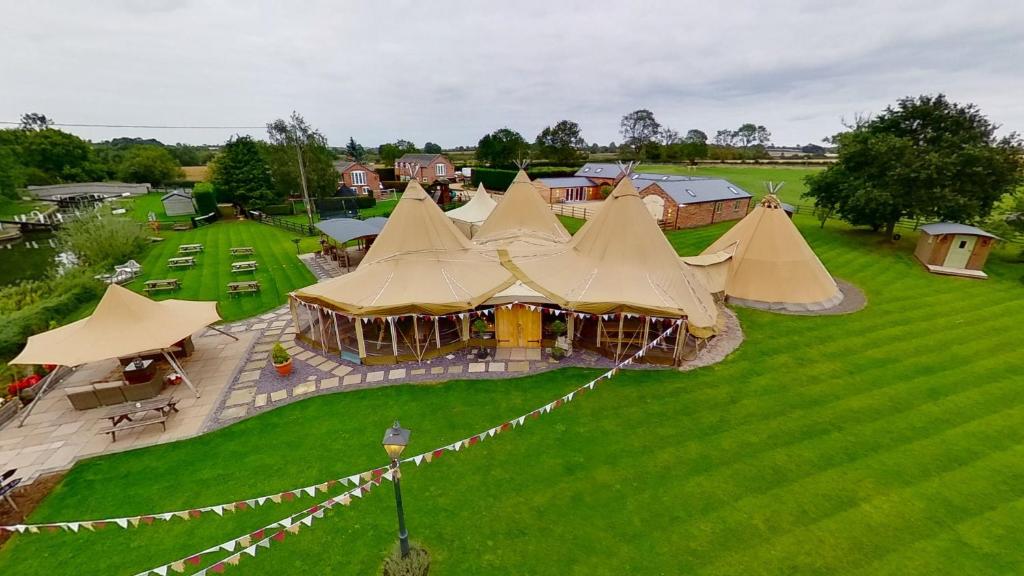 an overhead view of a group of tents in a field at Bridge House Barn in Kibworth Harcourt