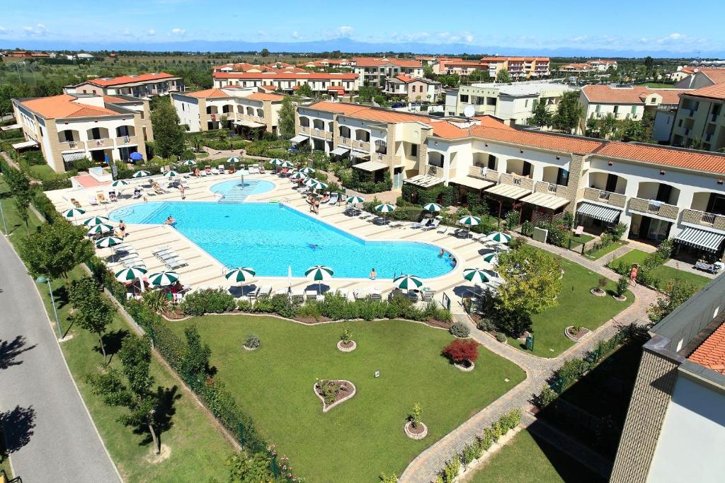 an aerial view of a resort with a large swimming pool at BETULLE Lido Altanea in Caorle