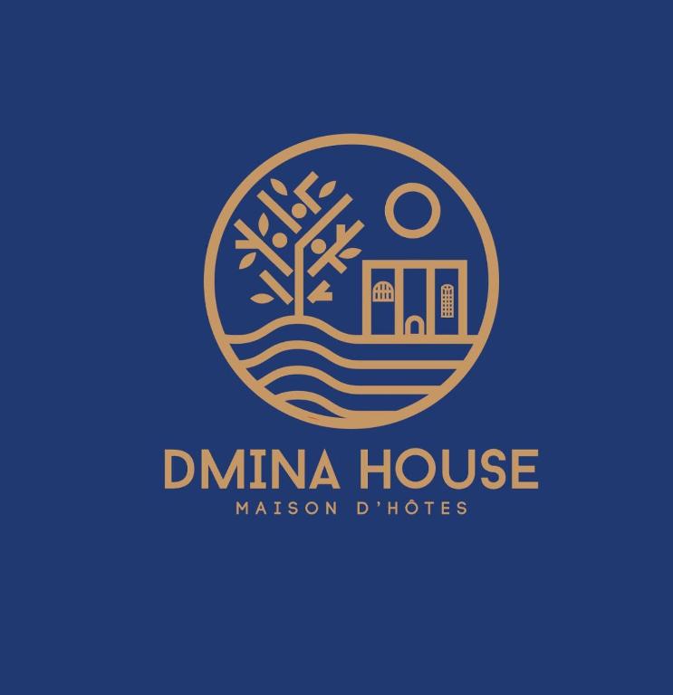 a logo for a dumma house at Dmina House in Asilah