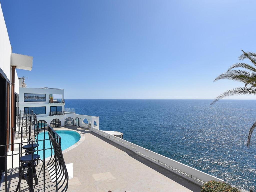 a view of the ocean from the balcony of a house at Sea Heaven 302 by VillaGranCanaria in San Agustin