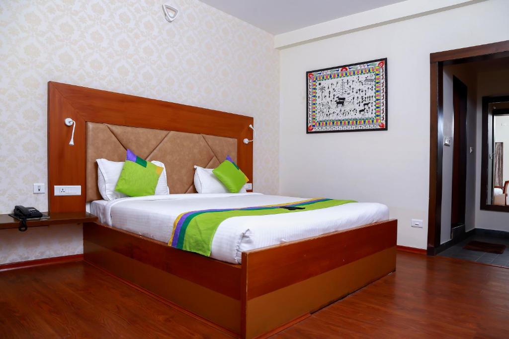 Postel nebo postele na pokoji v ubytování Yantra Resort By Spree Ooty