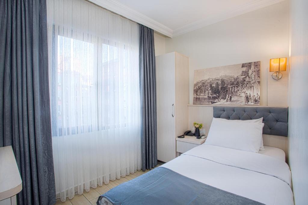 Postel nebo postele na pokoji v ubytování Sim Hotel Istanbul Old City