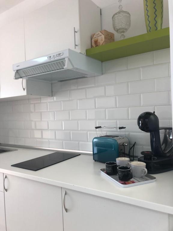 A kitchen or kitchenette at Apartamentos Elena