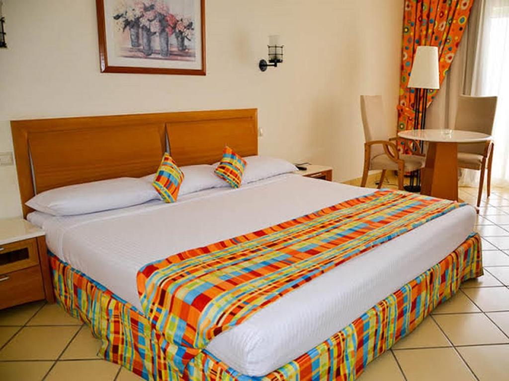 Postel nebo postele na pokoji v ubytování Siva Sharm Resort & SPA