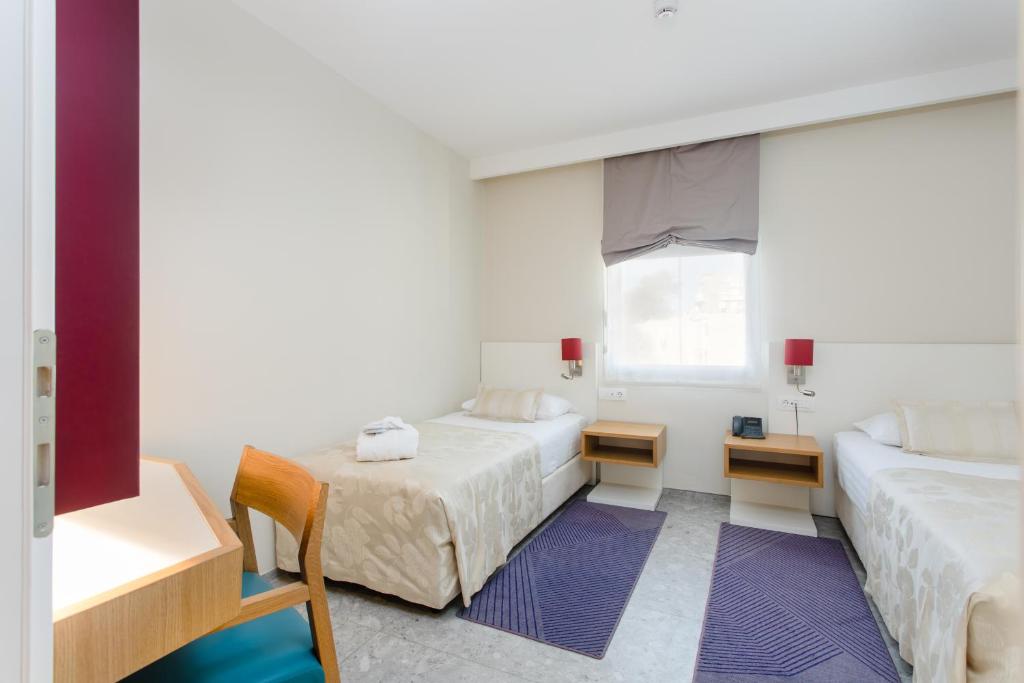 Postel nebo postele na pokoji v ubytování Hotel Lero