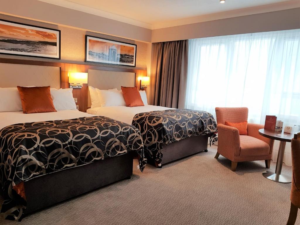 Postel nebo postele na pokoji v ubytování Clayton Hotel Silver Springs