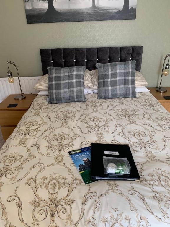 A bed or beds in a room at Wentworth Guest House 