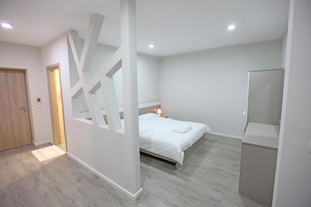 Postel nebo postele na pokoji v ubytování Star Hotel Saranda